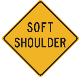 The ground on the side of the road is soft. Don’t leave the pavement except in an emergency. 