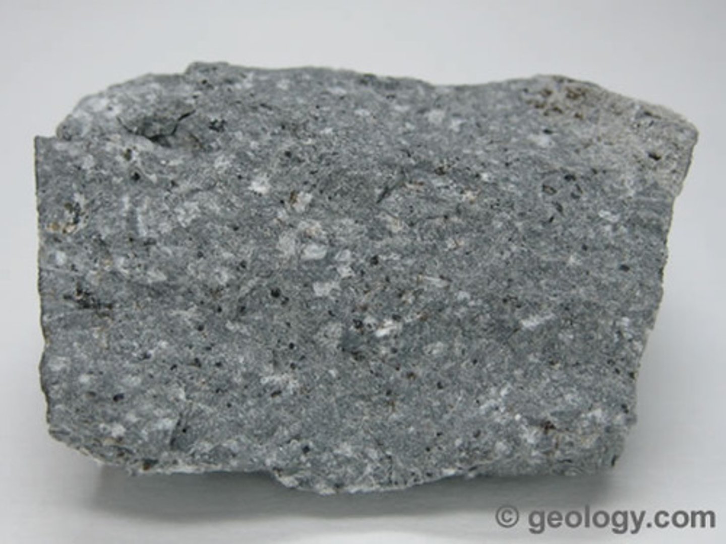 <p>igneous rock, fine-grained, aphanitic, plagioclase feldspars dominate with some amphibole and pyroxene</p>
