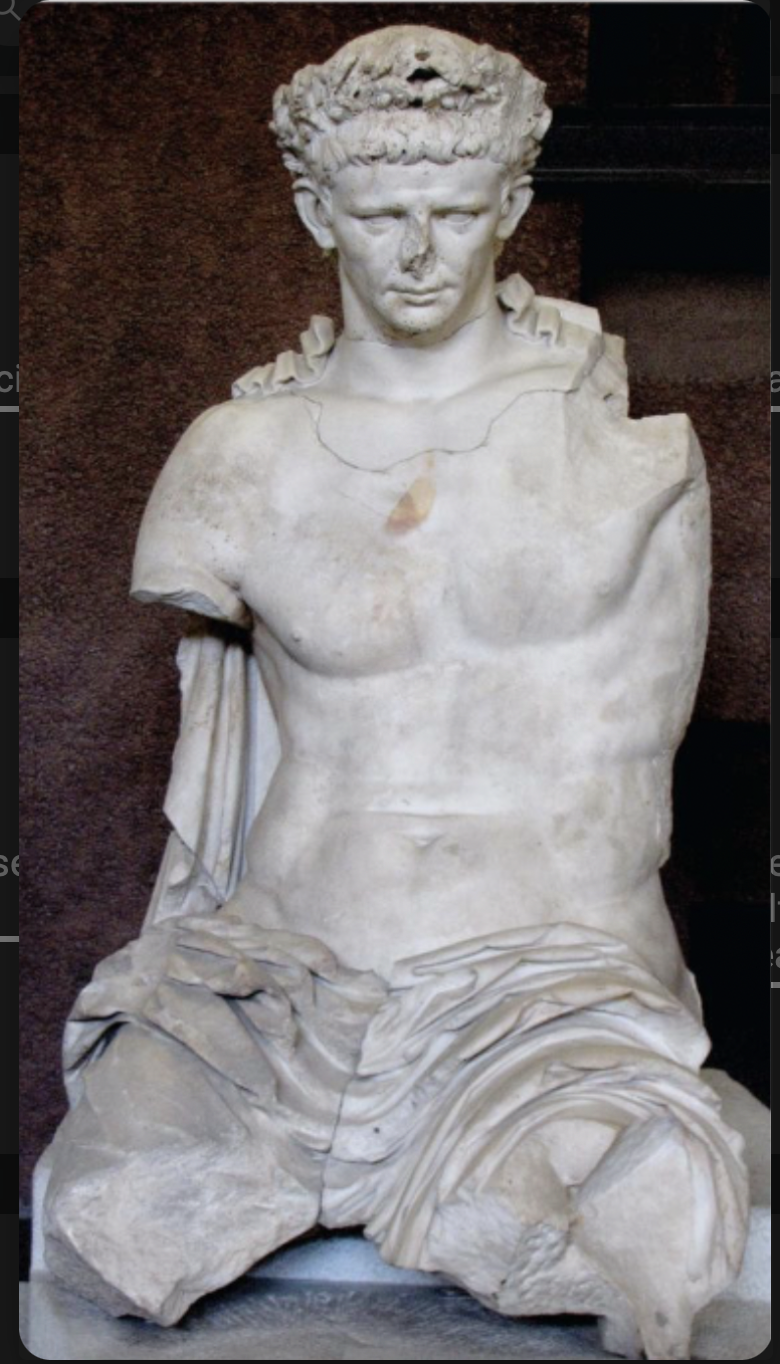 from the theater, cerveteri, has a realistic head but not an idealistic body. to separate himself from Caligula and Tiberius bc it is actually his face but an idealized body. 