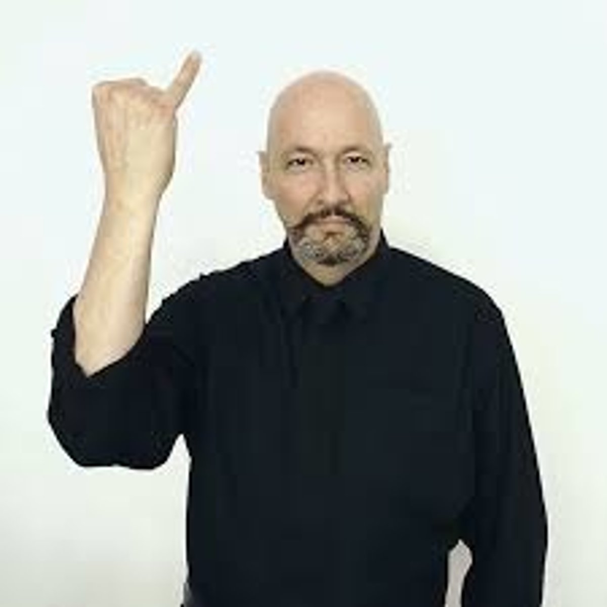 <p>With the hand closed, pinky finger extended, start with the pink finger touching the temple and move the hand away from the head.</p>