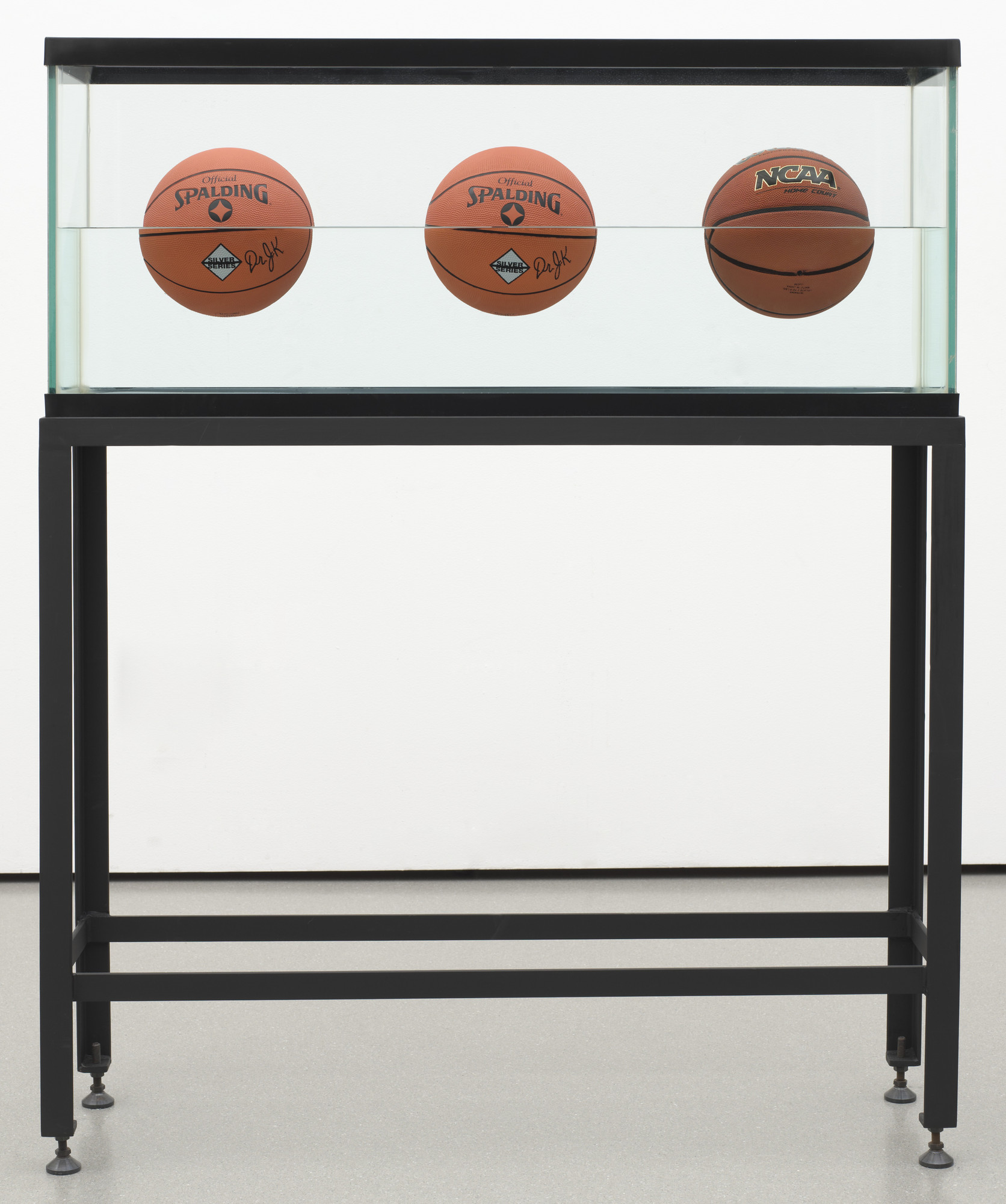<p>Three Ball 50/50 Tank (two Dr. J Silver Series, one Wilson Supershot), 1985</p>