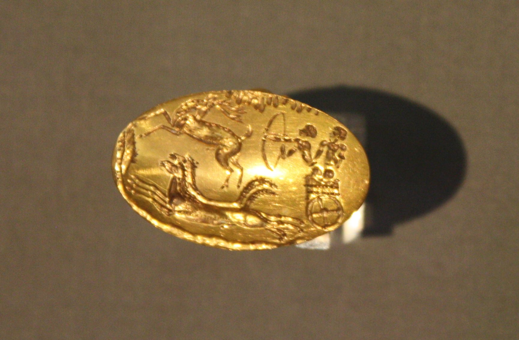 <p>Signet ring of chariot hunt - ( Grave Circle A, Mycenae )</p>