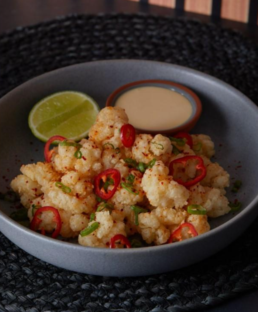 <p>crispy fried squid, fresno chilis, szechuan peppercorn, citrus dip, green onions. </p>