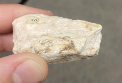 <p>Light pinkish, <strong>drywall</strong></p>