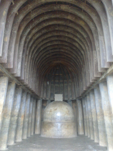 <p>a rock-cut shrine in basilican form with a stupa at the endpoint</p>