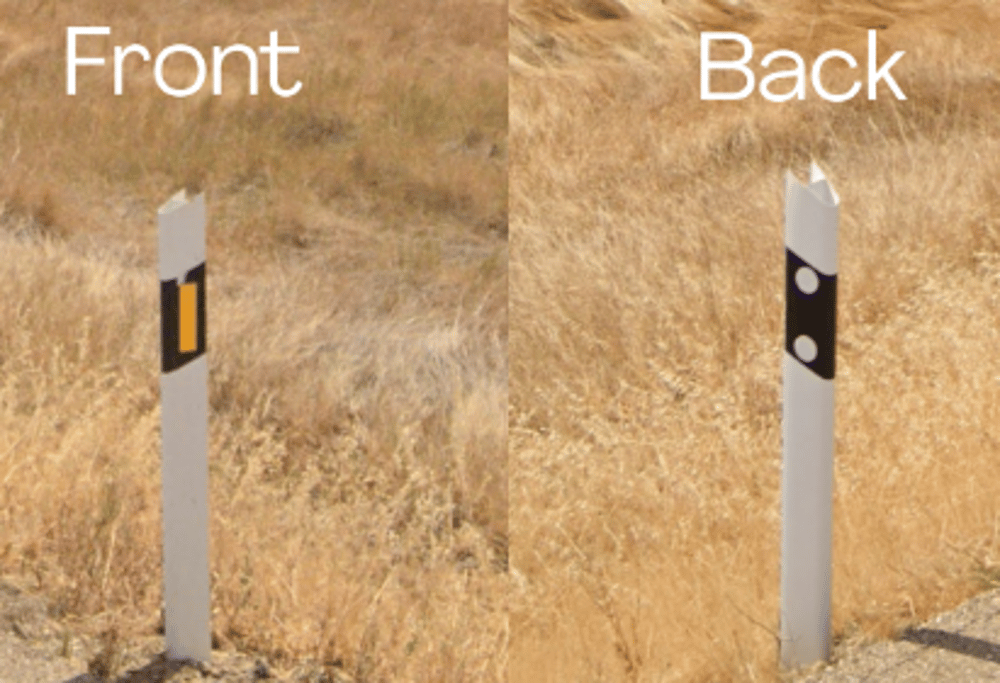 <p>Bollards with yellow-orange reflector and two white circles on back, hollow triangle shape</p>