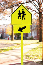 <p>At a school crossing sign, you should:</p>