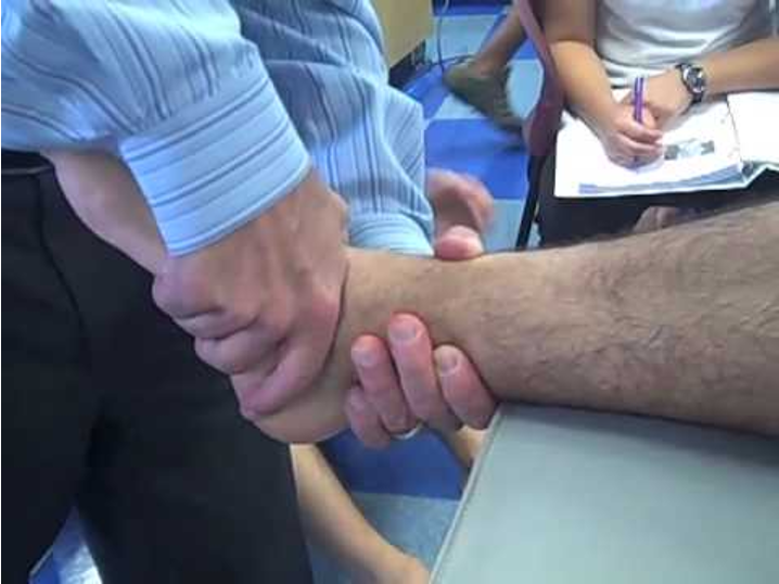 <p>Position: Leg supported on table. Hands at joint line Slight PF</p><p>Purpose: dorsiflexion</p>