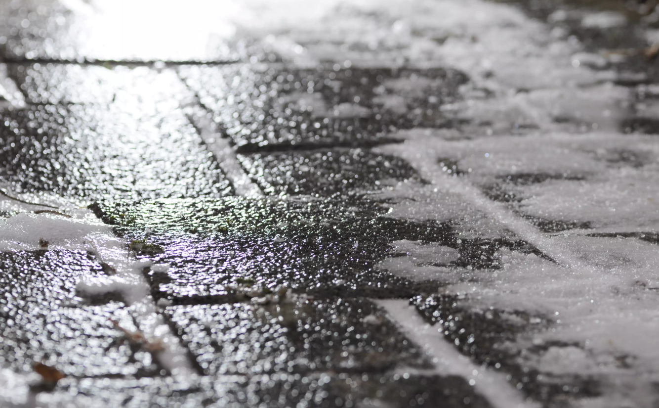<p>A thick coat of highly transparent ice that blends into the road and makes it harder to see. </p>