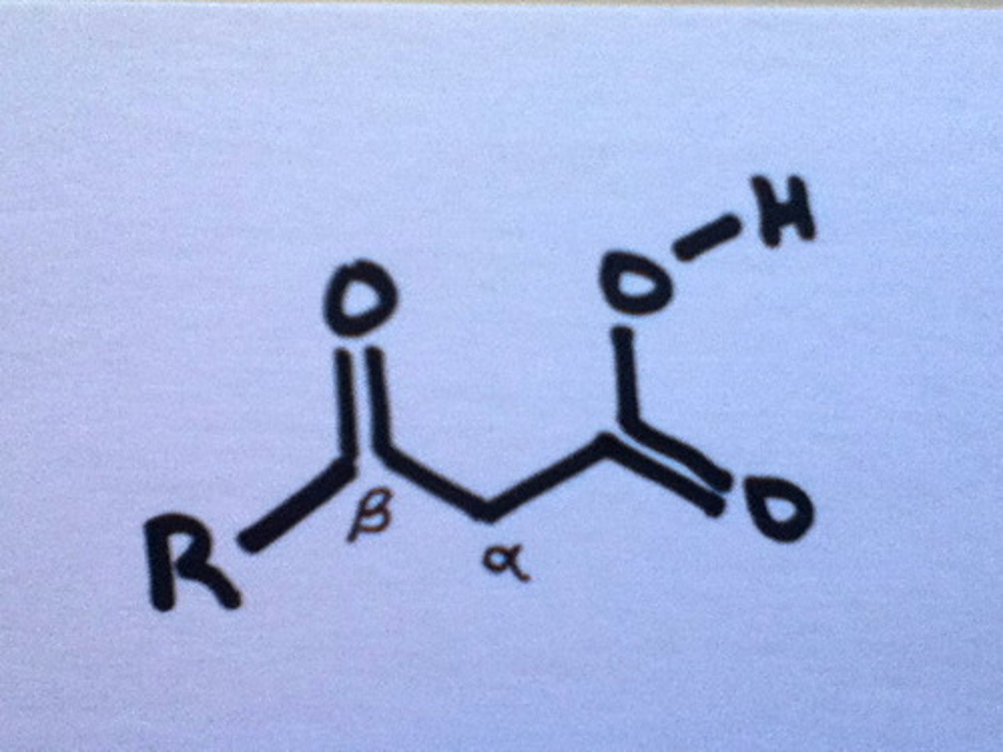 <p>(B) Carbonyl, β</p><p>A decarboxylation reaction can occur when their is a Carbonyl functional group that is β to a Carboxylic Acid functional group.</p>