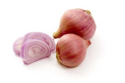 have a layered exterior that is a pink-red color, just like onions. However, they are longer and are more of an oblong shape. They are layered inside with white and red-purple colors.