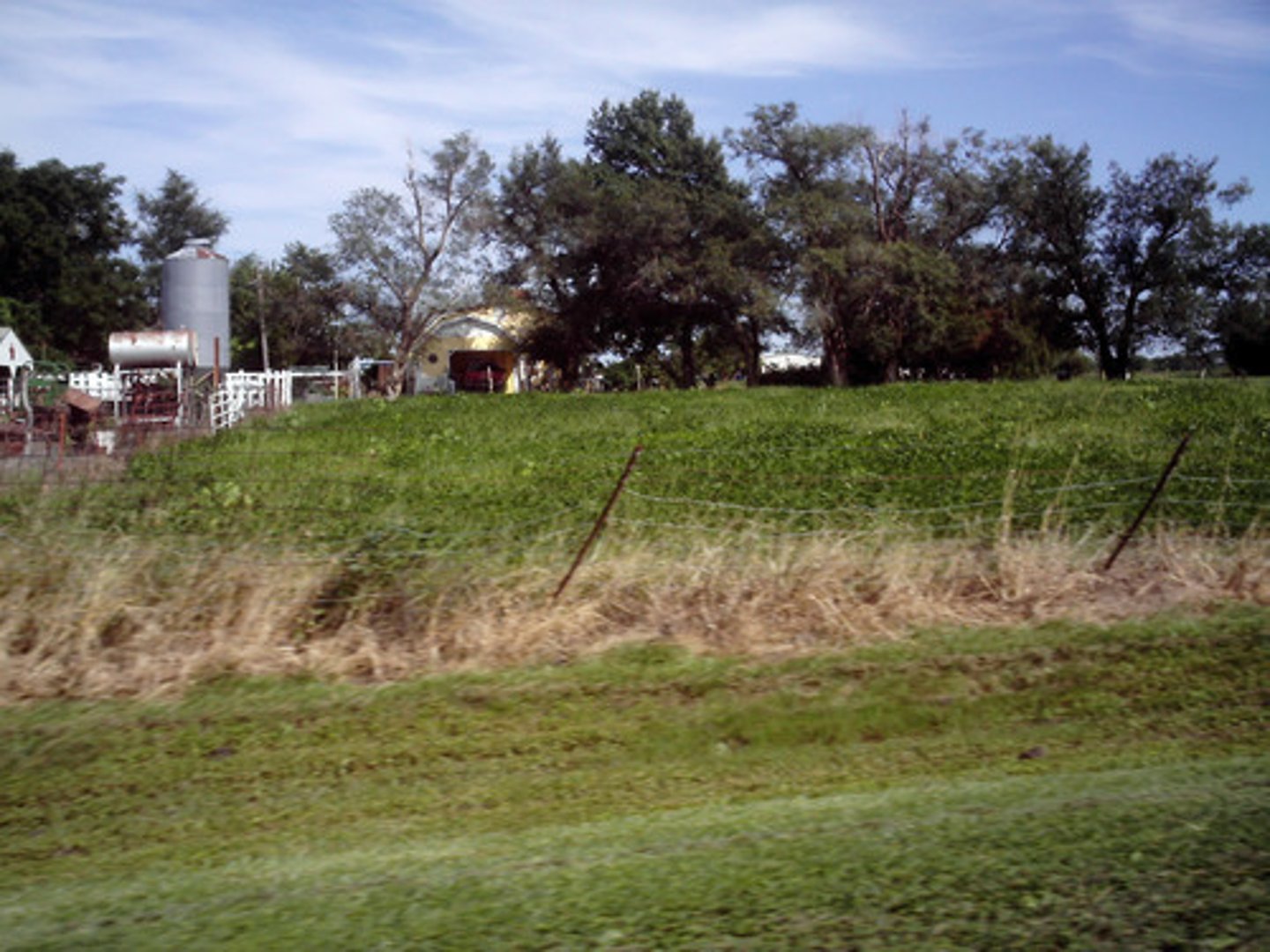 <p>Describing places in the countryside, usually some distance away from cities and suburbs.</p>