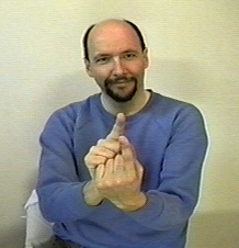 <p><span style="font-size: medium">"index finger" handshapes.&nbsp;The two hands "meet" in the middle. can move in the direction of who the signer is talking about. index fingers do not touch</span></p>