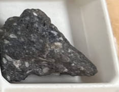 <p>Origin: extrusive </p><p>Texture: porphyritic-aphanetic </p><p>Color- intermediate </p><p>Cooling rate: 2 rates </p><p>Special: white spots </p>