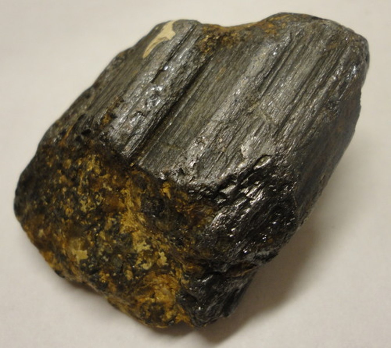 <p>Rutile group.<br>Tetragonal.<br>Slender acicular, also massive and compact.<br>H = 6-6.5<br>SG = 4.18-4.25<br>Transparent to sub-translucent.<br>Adamantine to sub-metallic luster.<br>Color = red, reddish-brown to black<br>Streak = pale brown.<br>Solid solution with anatase (tetragonal) and brookite (orthorhombic).<br>Isostructural with stishovite.</p>