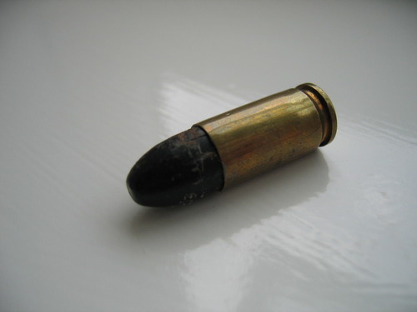 <p>(n.) an object, usually metal, that is put in a gun and shot</p>