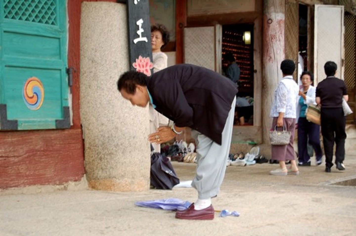 <p>a gesture expressing deferential respect, such as a bow or curtsy.</p>