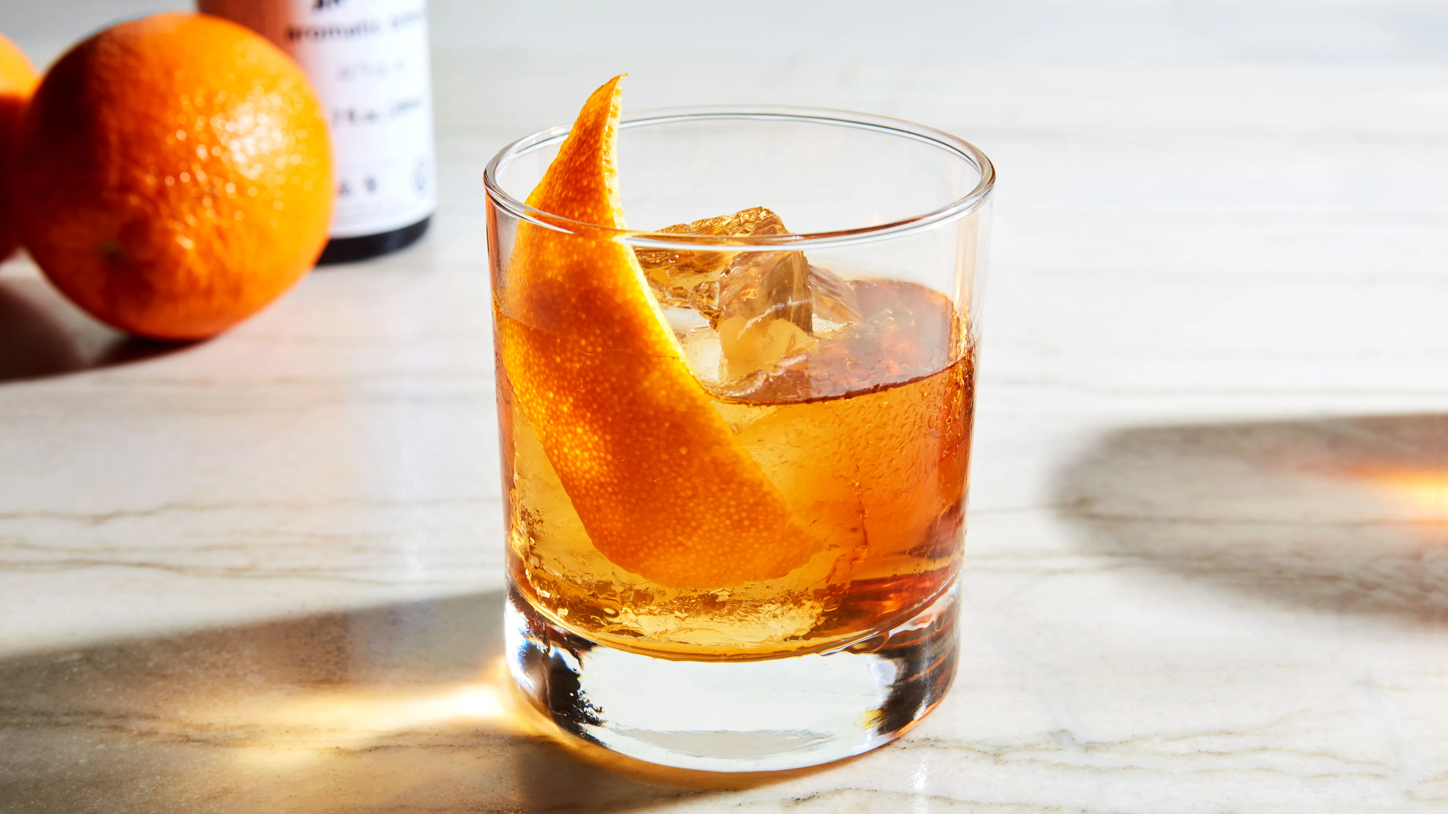 <p>old fashioned, 2 oz rye or bourbon, bar spoon of sugar, 3 dash angostura bitters, served on the rocks, garnished with orange peel or cherry</p>