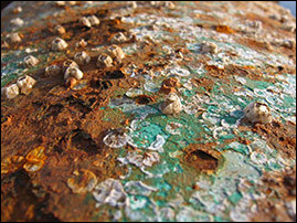 <p>the process of deterioration of metals due to chemical reactions, typically with oxygen and moisture. </p>