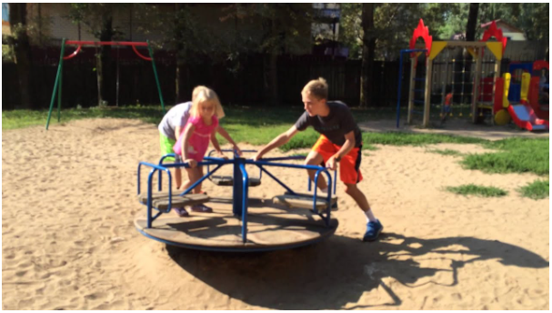 <p><strong>Rotation</strong></p><p><span>In the image below, the girl in the pink shirt and the boy in the grey striped shirt are two different distances from the center. Which one experiences the greater angular speed during rotation?</span></p>