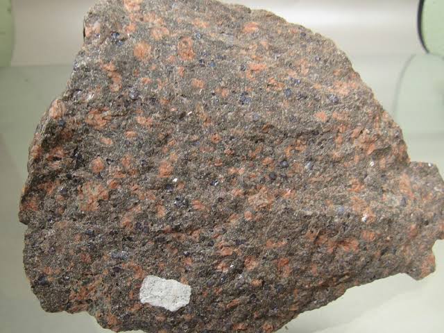 <p>Identify the igneous rock, its texture, and composition</p>