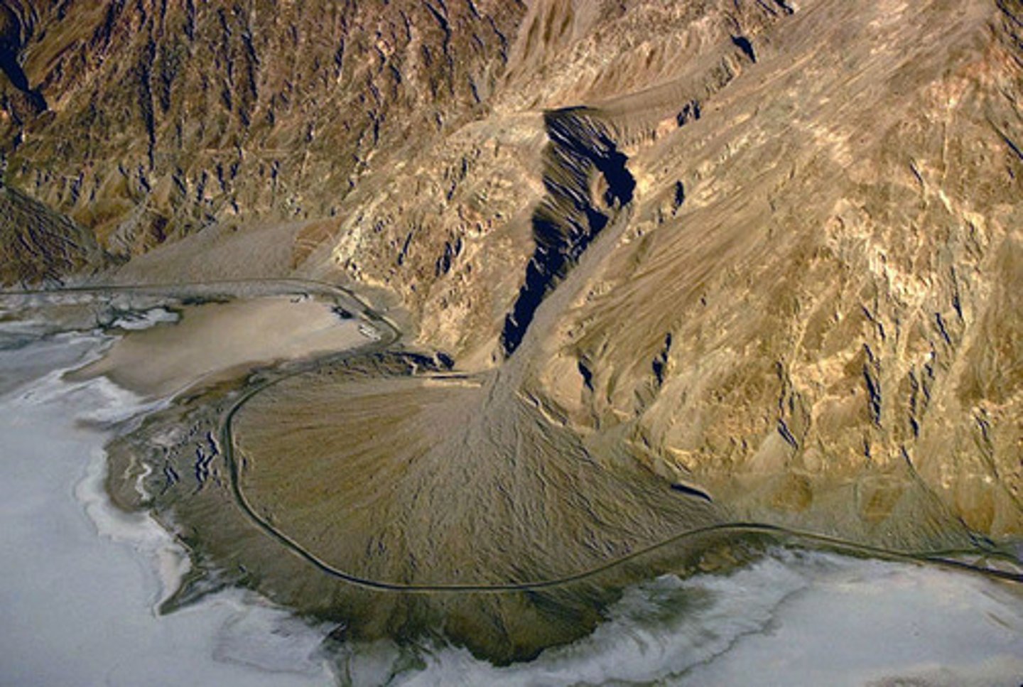 <p>Fan-shaped deposits of course sediments dropped by streams flowing out of mountains</p>