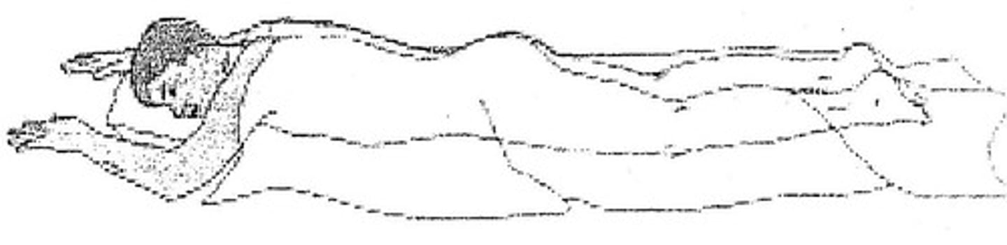 <p>Lying down flat on the belly.</p>