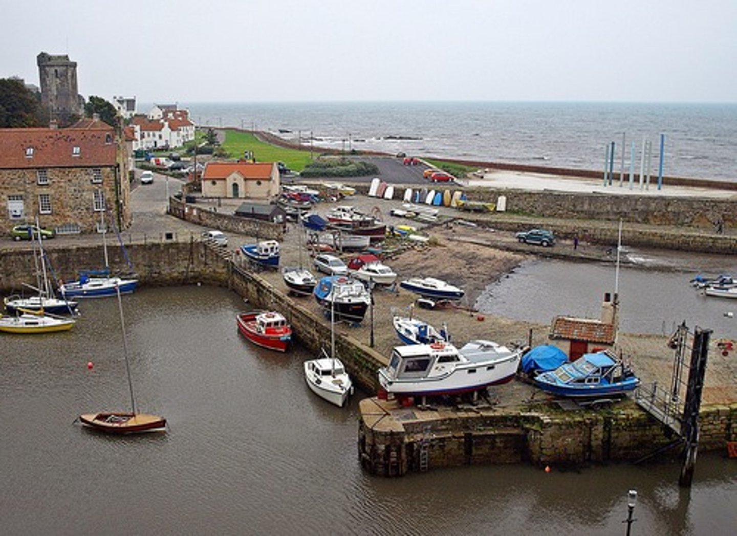 <p>an area of water next to the land where boats can stop</p>