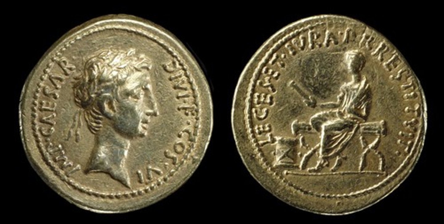 <p>- aureus, circulated among the wealthy</p><p>- obv. Octavian wearing a laurel wreath, his triple triumph</p><p>- rev. Octavian on bench holding a scroll</p><p>- legend says 'restored to the roman people their laws and rights' link to first settlement 27 Bc</p><p>- senatorial pose and message, republic focus</p>