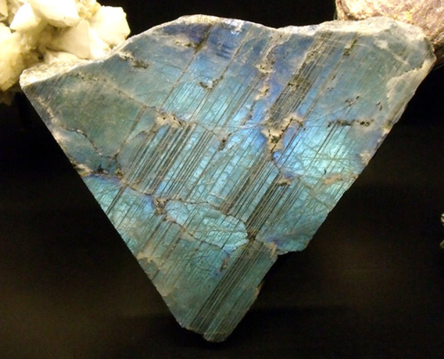 <p>Non Metallic Luster. 6.0 harness. White streak. 2.7 SG. White to dark grey color, striations on some cleavage planes; two cleavage planes at ~90, rare blue iridescence.</p>