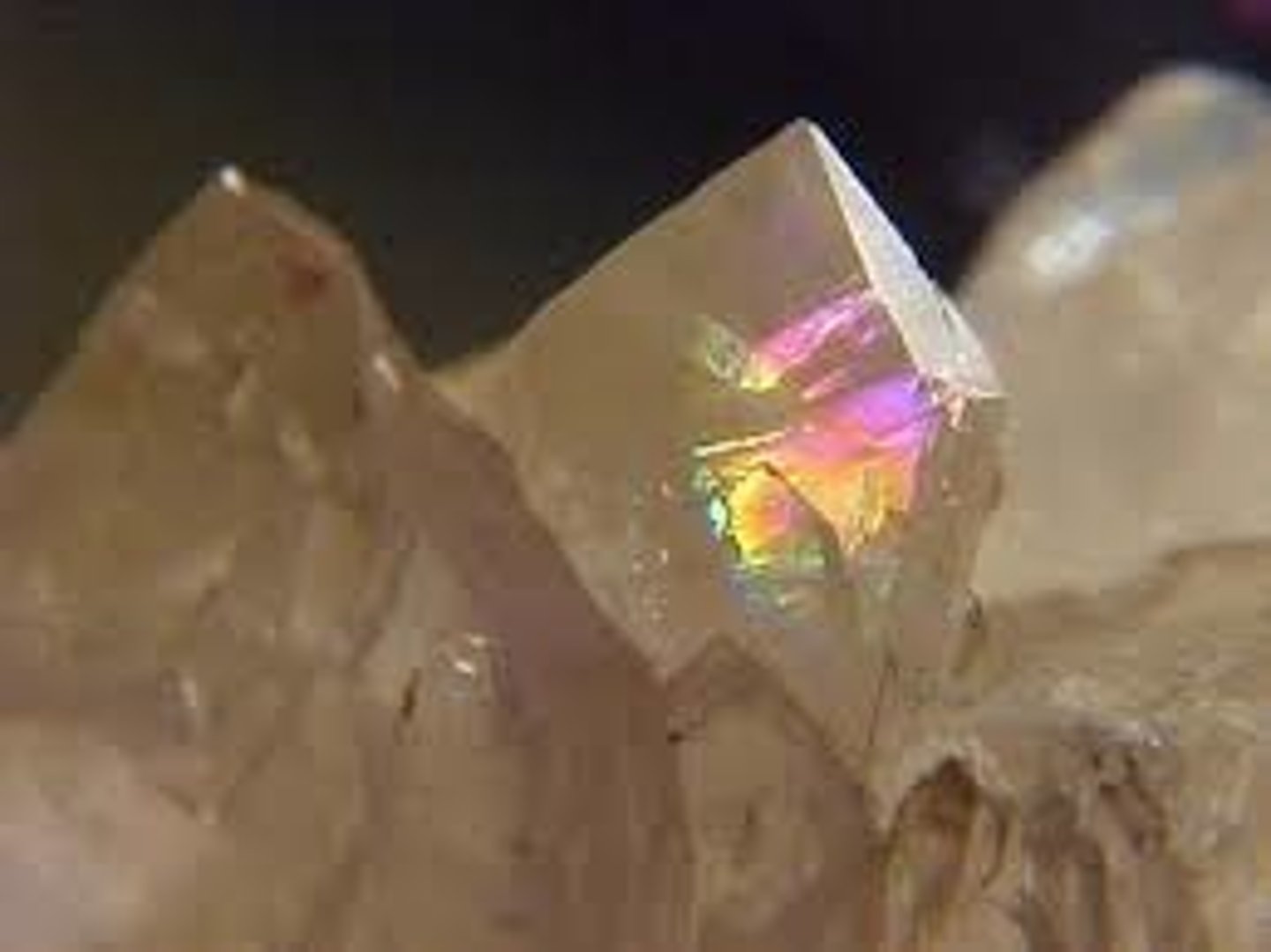<p>A mineral that refracts light into multiple colors, appearing as an oil spill (iris quartz)</p>