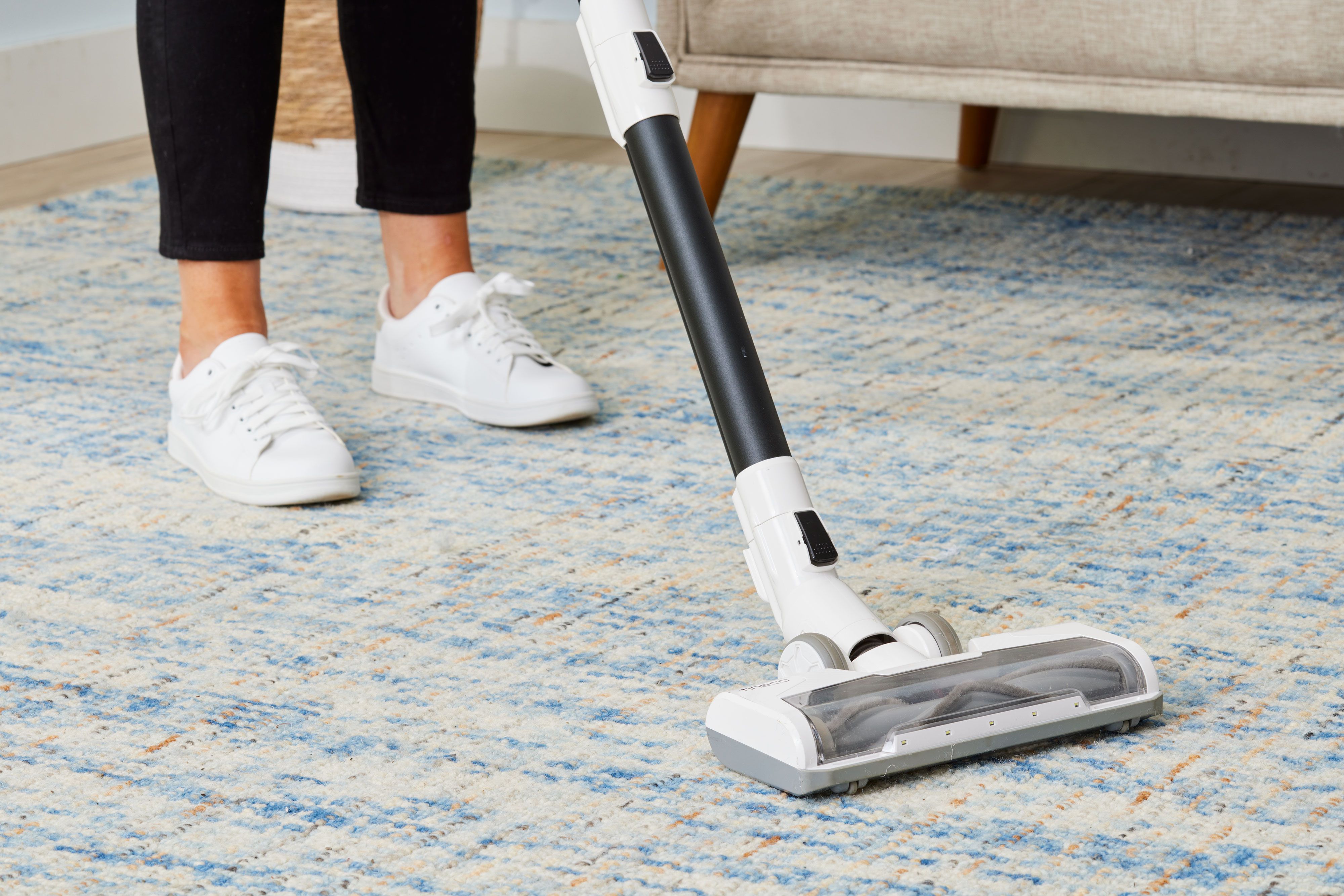 <p>Vacuuming the floor</p>