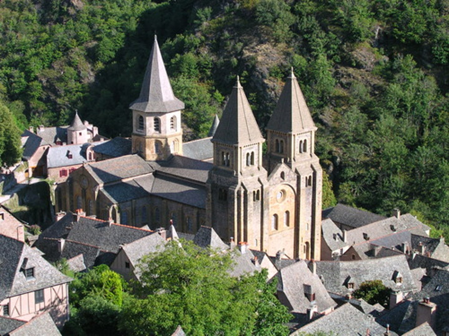 <p>Conques, France</p><p>Romanesque pilgrimage church (spiritual tourism spot for the medieval traveller)</p><p>Visited these churches because it put the people closer to God</p><p>Barrel-vaulted nave with arches in the interior</p>