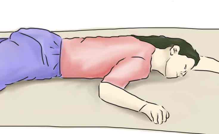 <p>Lying down face down </p>