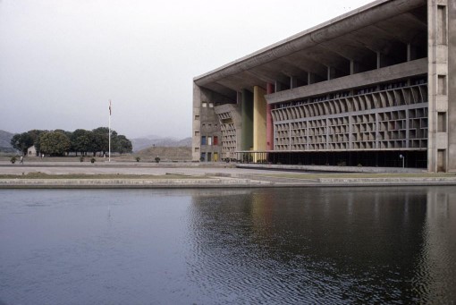 <p>This is the <strong>Supreme Court building</strong> in <strong>Chandigarh, India,</strong>&nbsp;designed by&nbsp;<strong>Le Corbusier</strong>. It serves as the checks and balances to the general assembly building. <strong>The water in front of the building is symbolic and represents the reflection of truth by the court system.</strong></p>