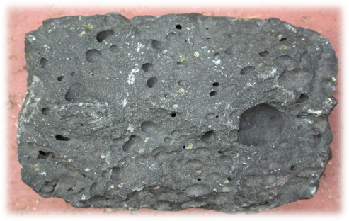 <p><span style="font-size: 12.8px; font-family: lato, sans-serif">igenous rock with a vesicular texture and mafic composition, however this rock is much heavier than its vesicular rock counterparts</span></p>