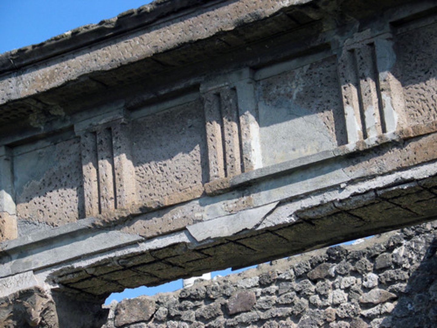 <p>a projecting grooved element alternating with a metope on a Greek temple</p>