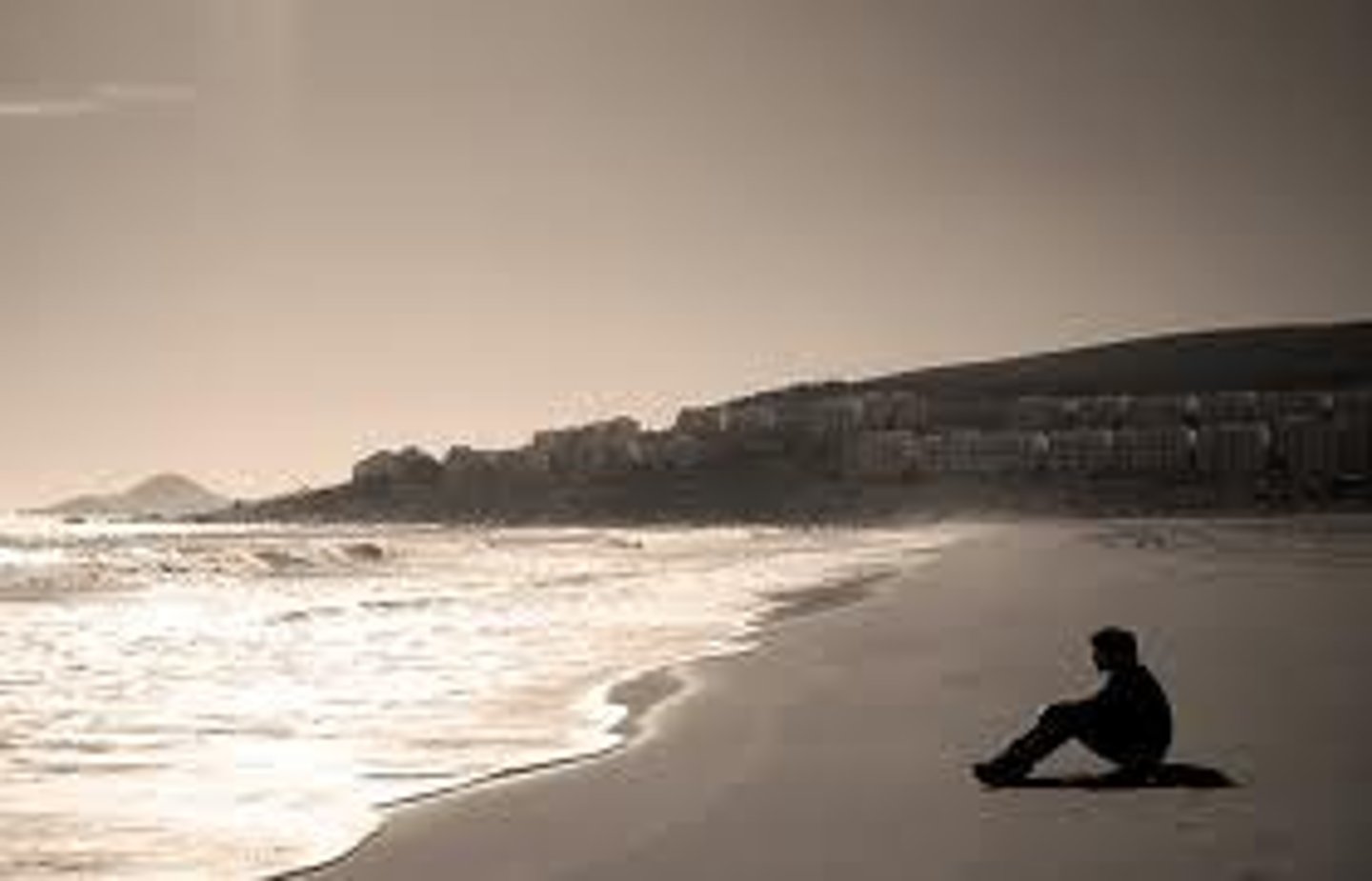 <p>He is ___ on the beach.</p>