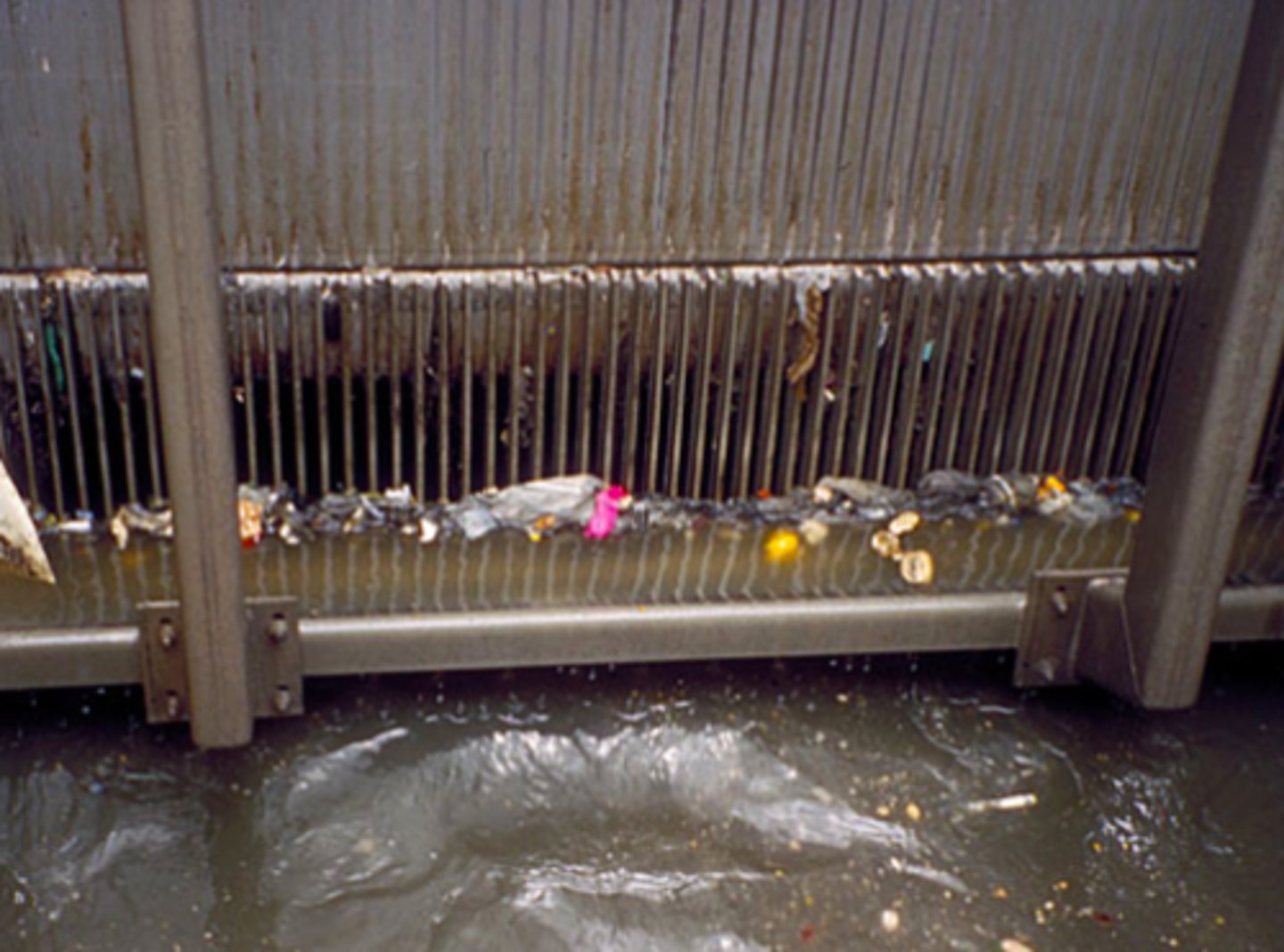 <p>A physical, metal filter that traps large debris in sewage like paper, plastic, or other garbage</p>
