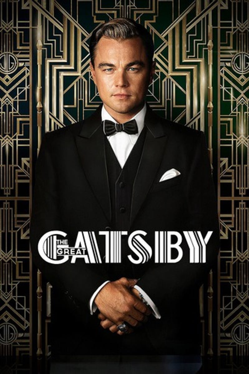 <p>He wears a white suit with a silver shirt and gold tie, but he is pale and has dark circles under his eyes from no sleep.</p>