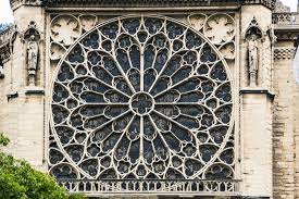 A circular window with a symmetrical pattern, often filled with stained glass, found in Gothic cathedrals.