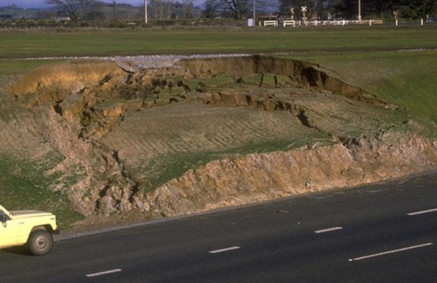 <p>a large mass of rock and soil suddenly slip down a slope</p>