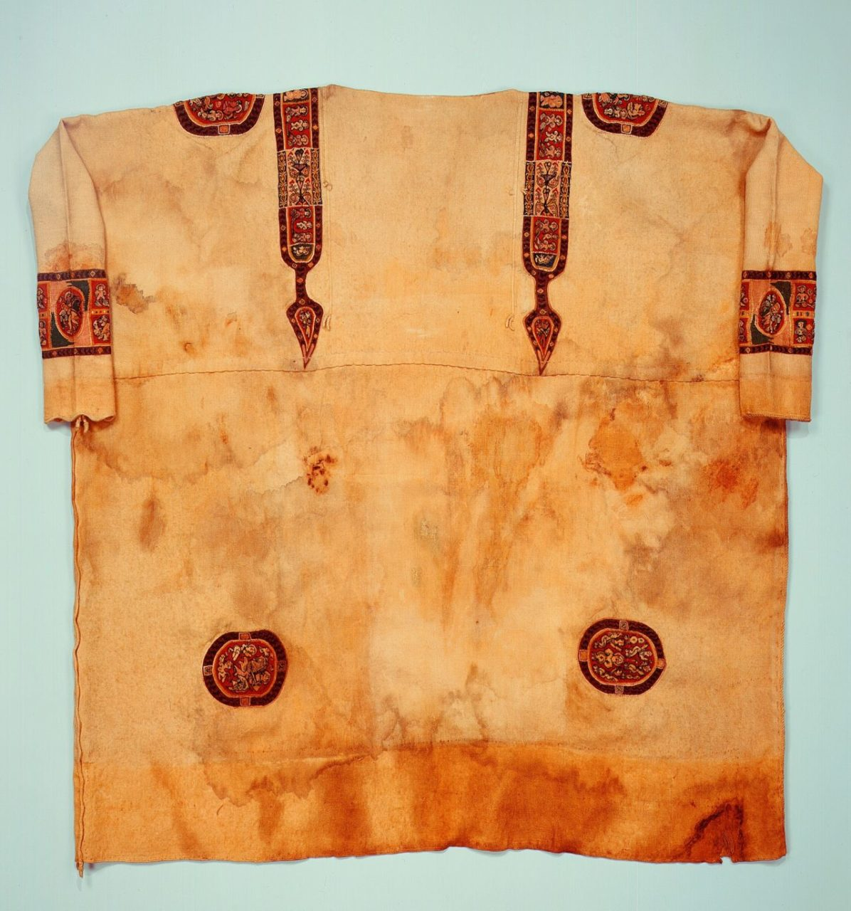 <p><span style="background-color: transparent;">decorative bands of color appliqued to sleeves and body of the dalmanic</span></p>