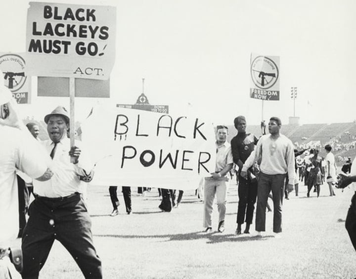 <p>A slogan used to reflect solidarity and racial consciousness, used by Malcolm X. It meant that equality could not be given, but had to be seized by a powerful, organized Black community.</p>