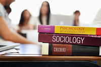 <p>a book containing detailed information and educational content, usually used in schools for study purposes. </p>