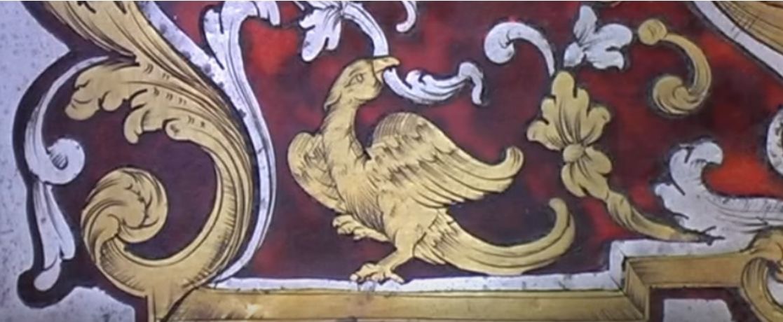 <p>an object or ornament that has been imbedded with different materials (wood, metal, glass, etc.) within it </p>