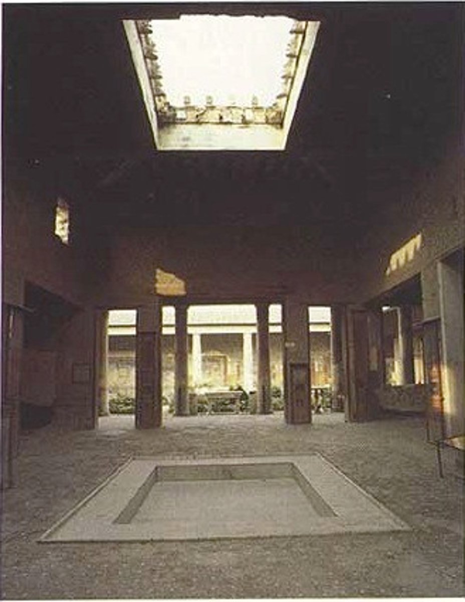 <p>An unroofed interior courtyard or room in a Roman house, sometimes having a pool or garden, sometimes surrounded by columns. Also: the open courtyard in front of a Christian church; or an entrance area in modern architecture.</p>