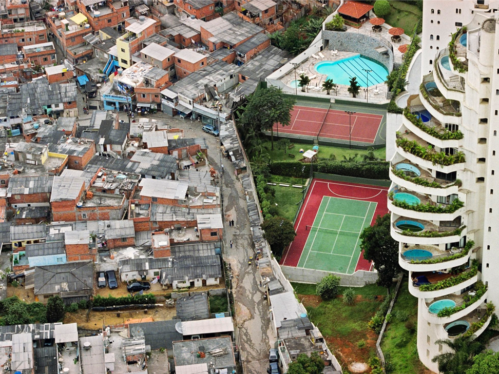 <p>an informal housing area beset with overcrowding and poverty that features temporary homes often made of wood scraps or metal sheeting</p><p>AKA favelas, barrios, shantytowns, slums (6.2)</p>