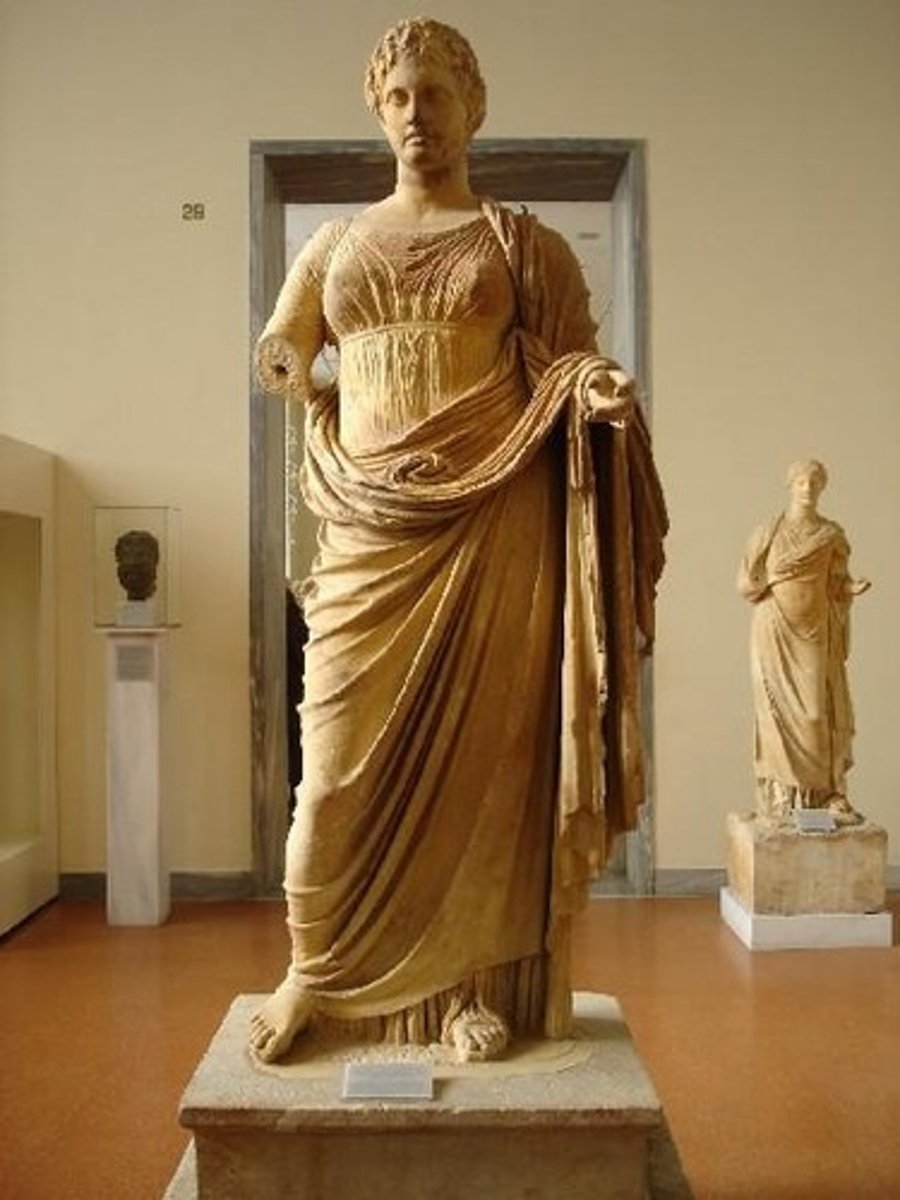 <p>goddess of justice. pentelic marble statue from Rhamnous (Attica). made by sculptor Chairestratos. dedicated by Megakles. ca. 300-250 BC. National Archaeological Museum, Athens. wears himation and chiton, chord under breasts. knot at her stomach is bizarre, face is smooth and clasiscal. very static piece. may have been a cult statue due to Rhamnous being a cult center for Themis and Nemesis</p>