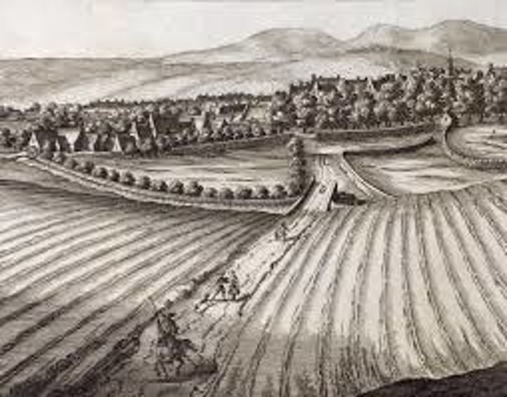 <p>consolidation and privatization of small landholdings/common lands into a smaller number of large farms in England c. 1700; contributed to the increase in population and the rise of industrialization as farmers were displaced and needed to find work in the cities</p>